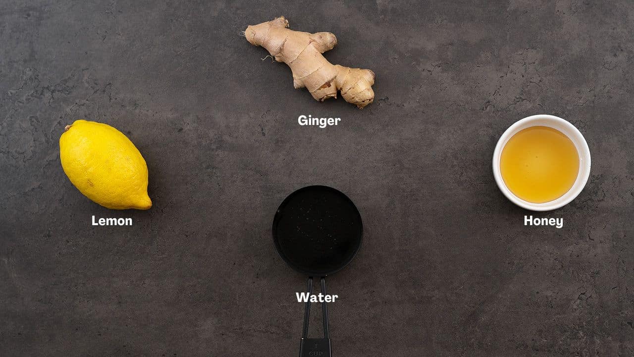 Lemon Ginger Water ingredients placed on a gray table.
