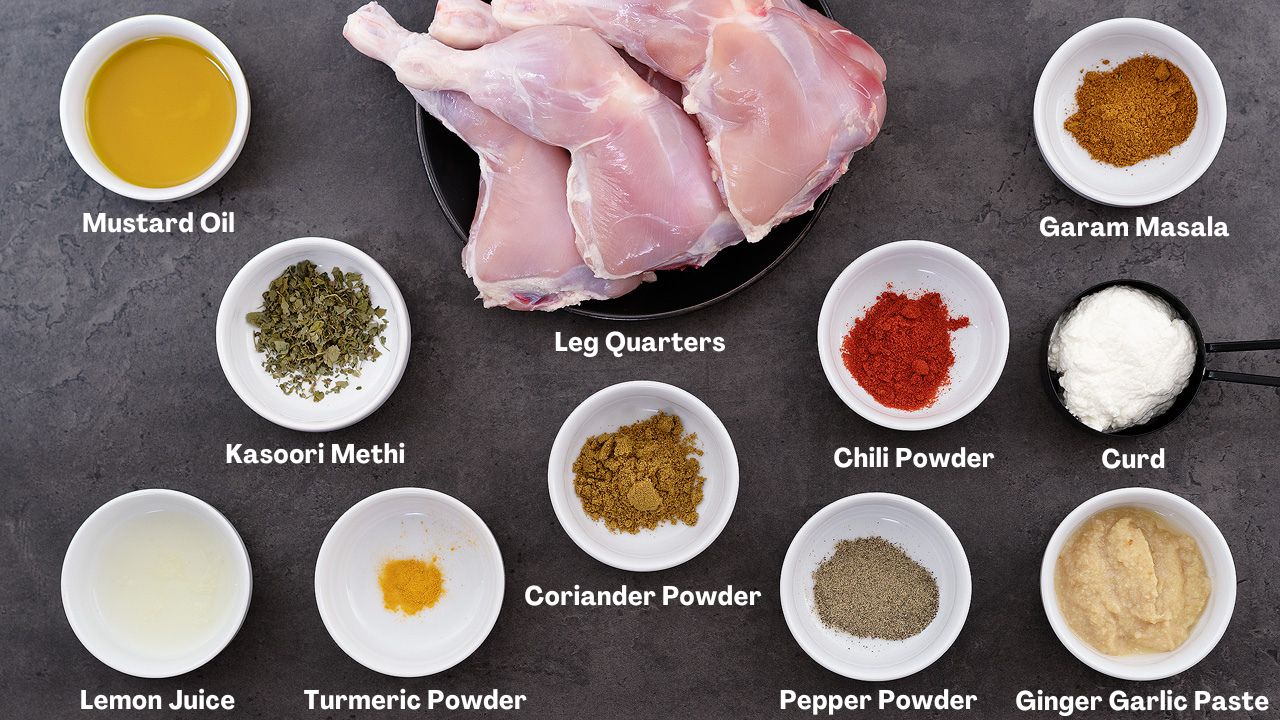 Tandoori Chicken recipe Ingredients placed on a grey table.