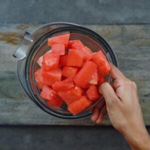 Frozen watermelon pieces in a glass bowl.