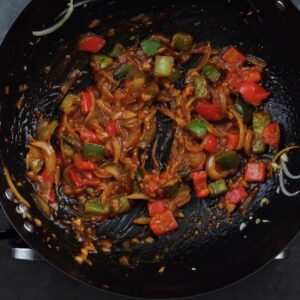 Glossy sauce veggie mixture in a wok.
