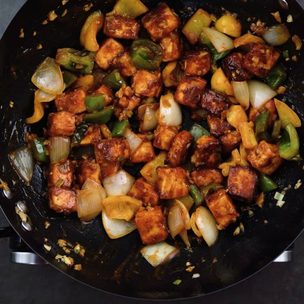 Chilli Paneer dry in a wok.