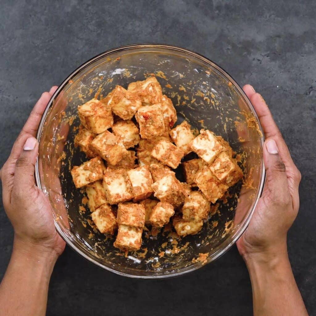 Marinated Paneer in a glass bowl.