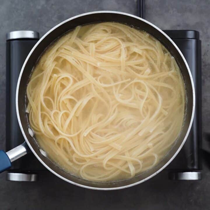 Fettuccine Pasta cooking in water.