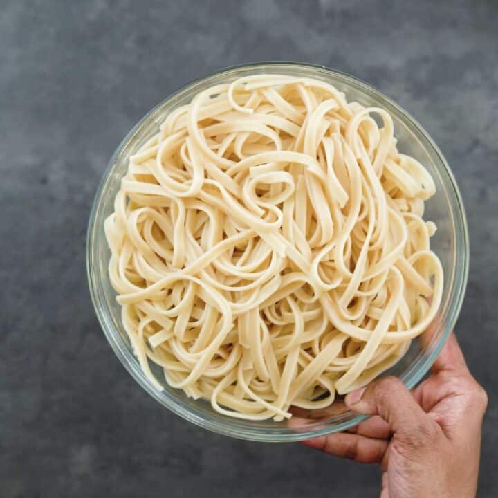Cooked and drained Fettuccine pasta.