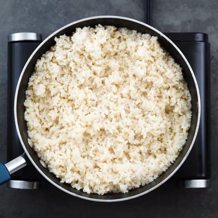 Cooked brown rice in a pan.