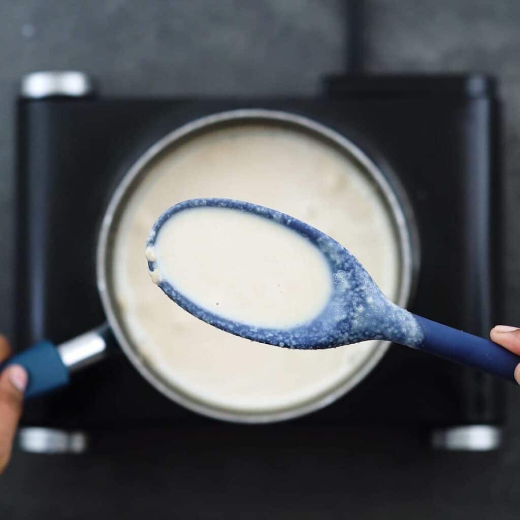 Showing the consistency of Mexican Atole.