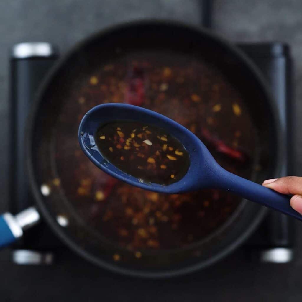Showing the consistency of stir fry sauce.