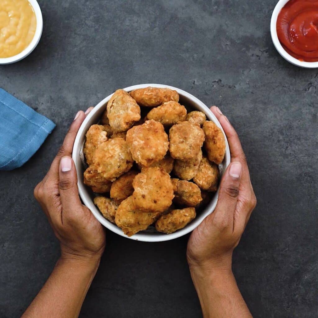 Serving Homemade Chicken Nuggets with ketchup on the side.