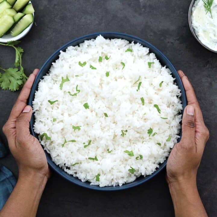 Serving the Jasmine rice in a blue serving bowl.