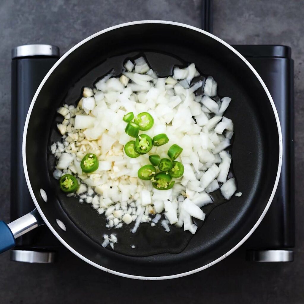 Onion, garlic and green chili in a pan.