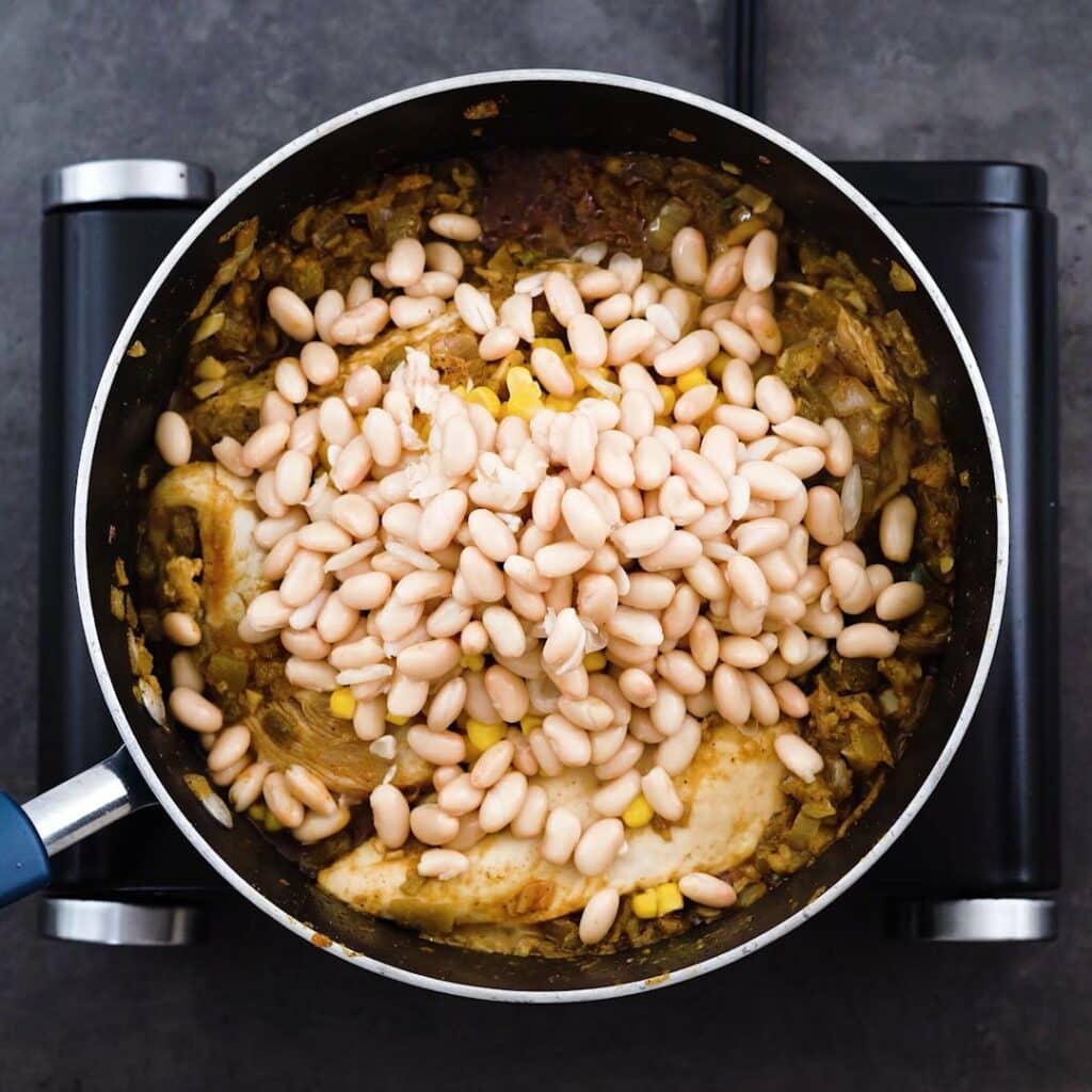 White beans, corn kernels added to chicken mixture.