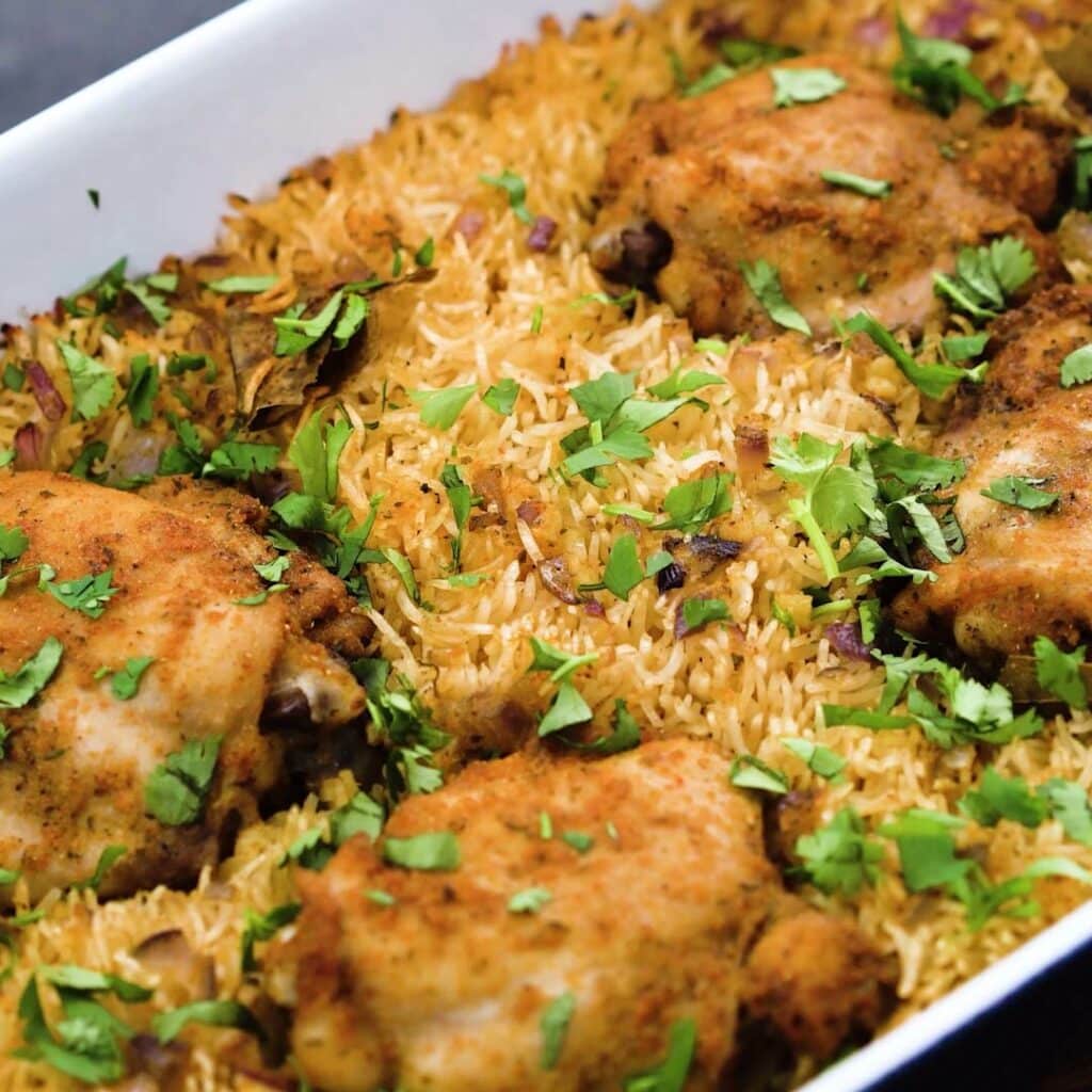Baked Chicken and Rice in a baking pan.