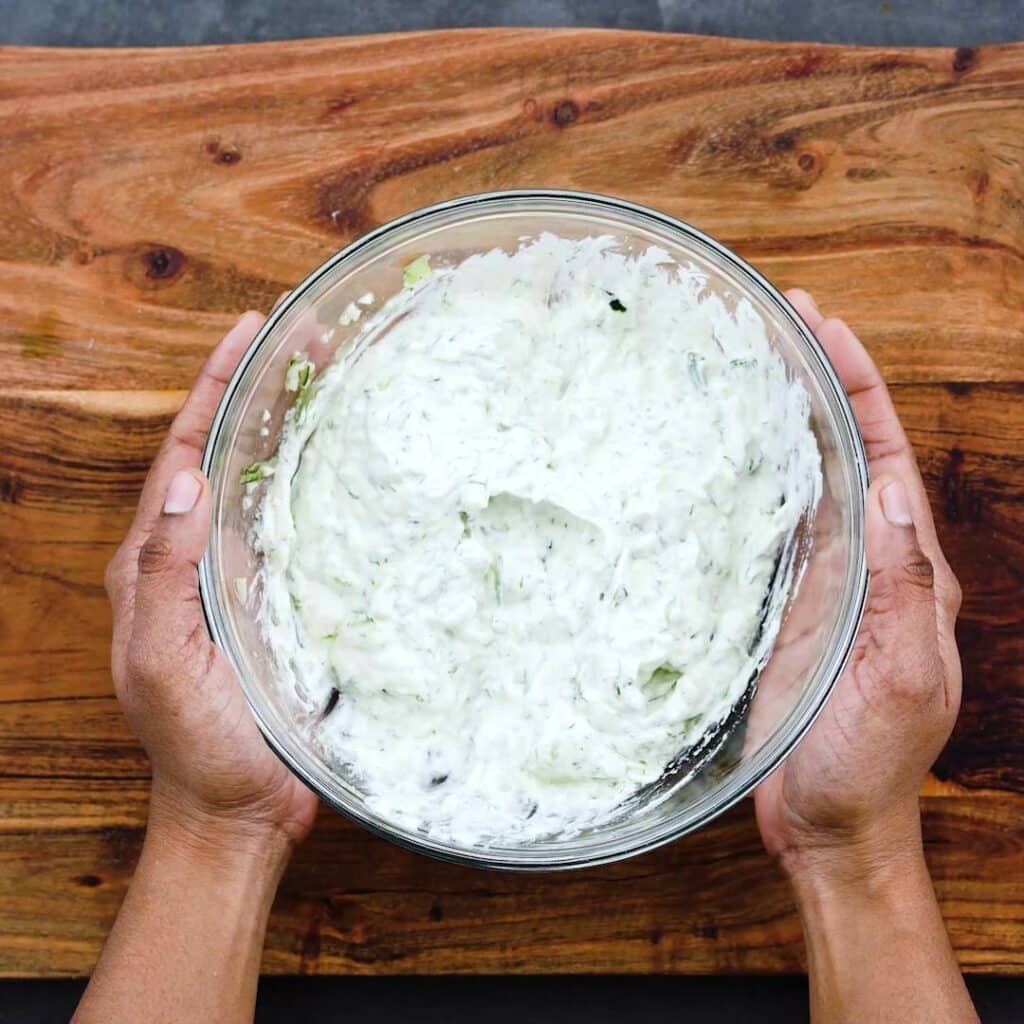 Creamy Tzatziki Sauce in a glass bowl.