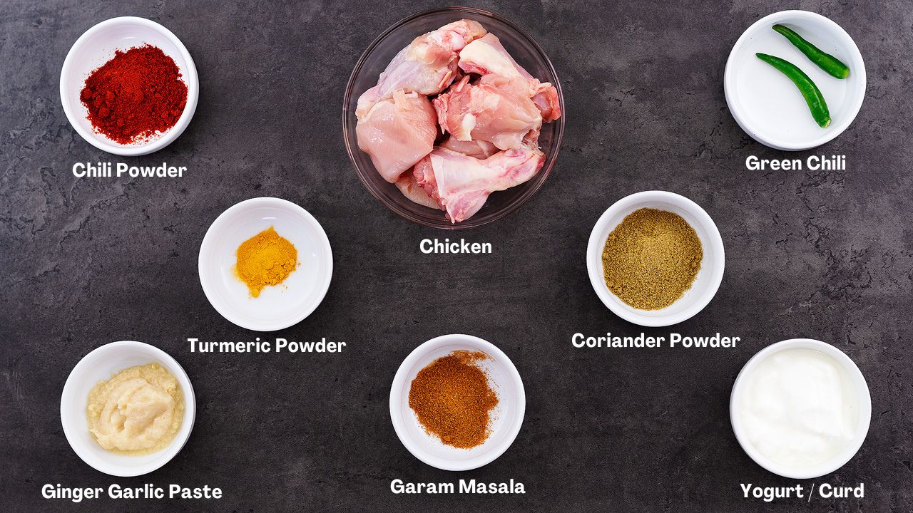 Chicken Korma recipe Ingredients arranged on a grey table.