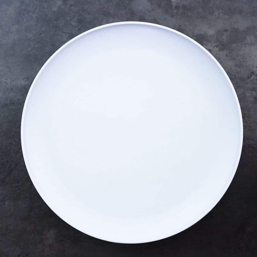 A bowl of chicken covered and left to rest with the lid closed.