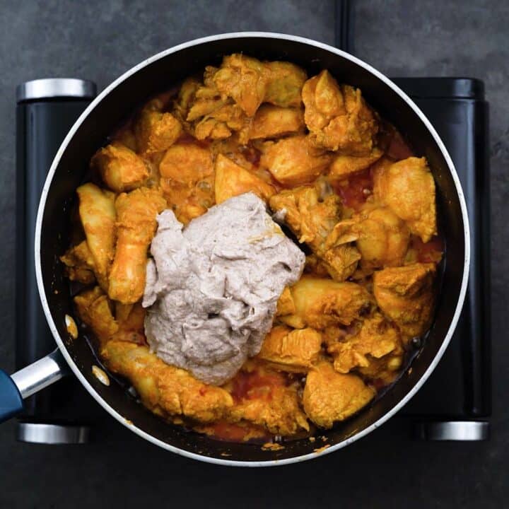 Korma Paste is added to marinated chicken.