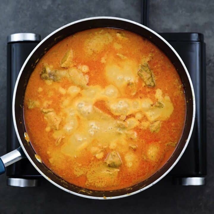 Chicken Korma is simmering in a pan.