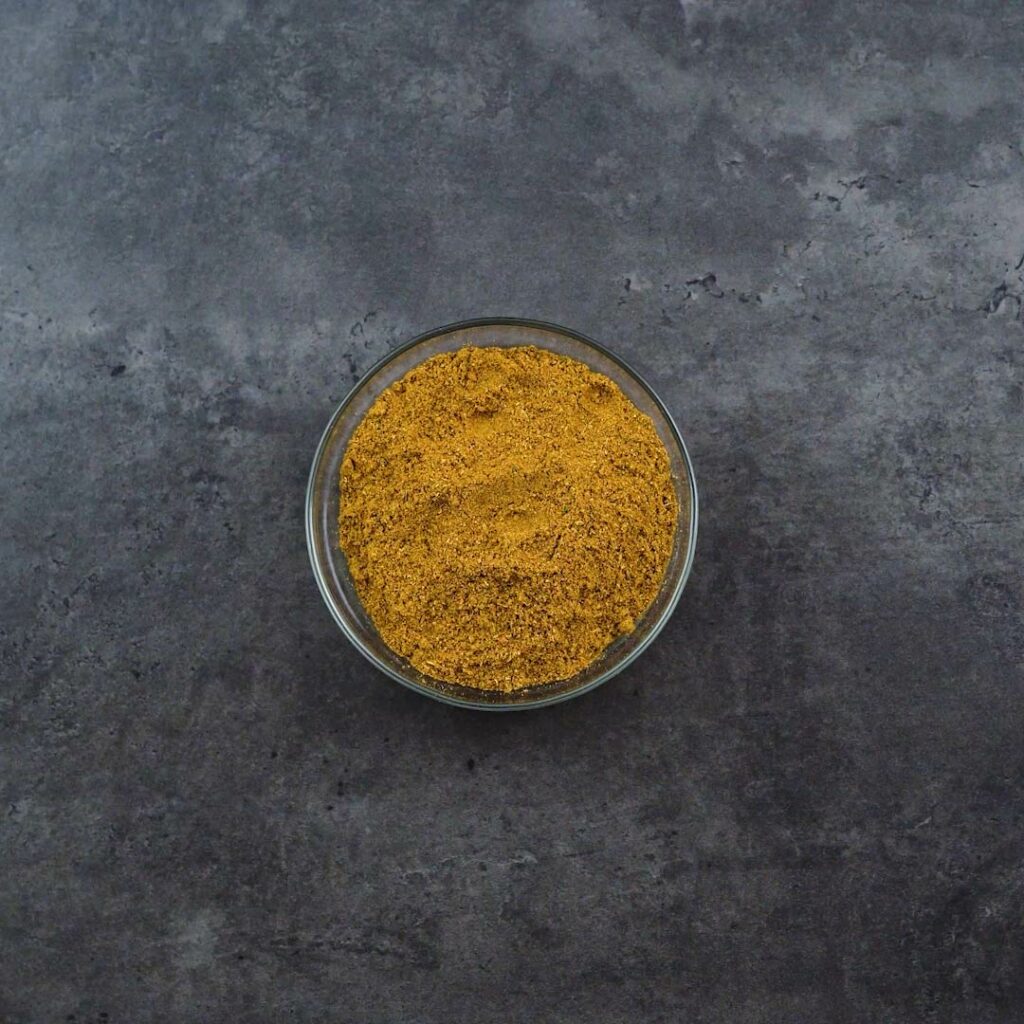 A bowl with curry powder.