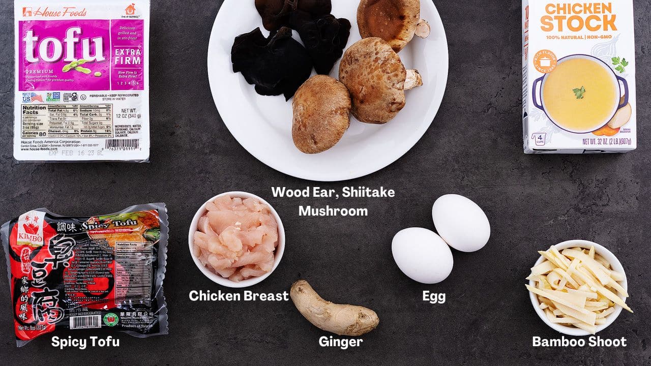 Hot and Sour Soup Ingredients arranged on a grey table.