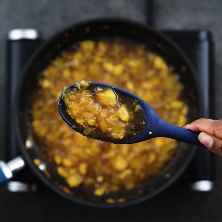 Showing the consistency of thick and sticky Mango Chutney.