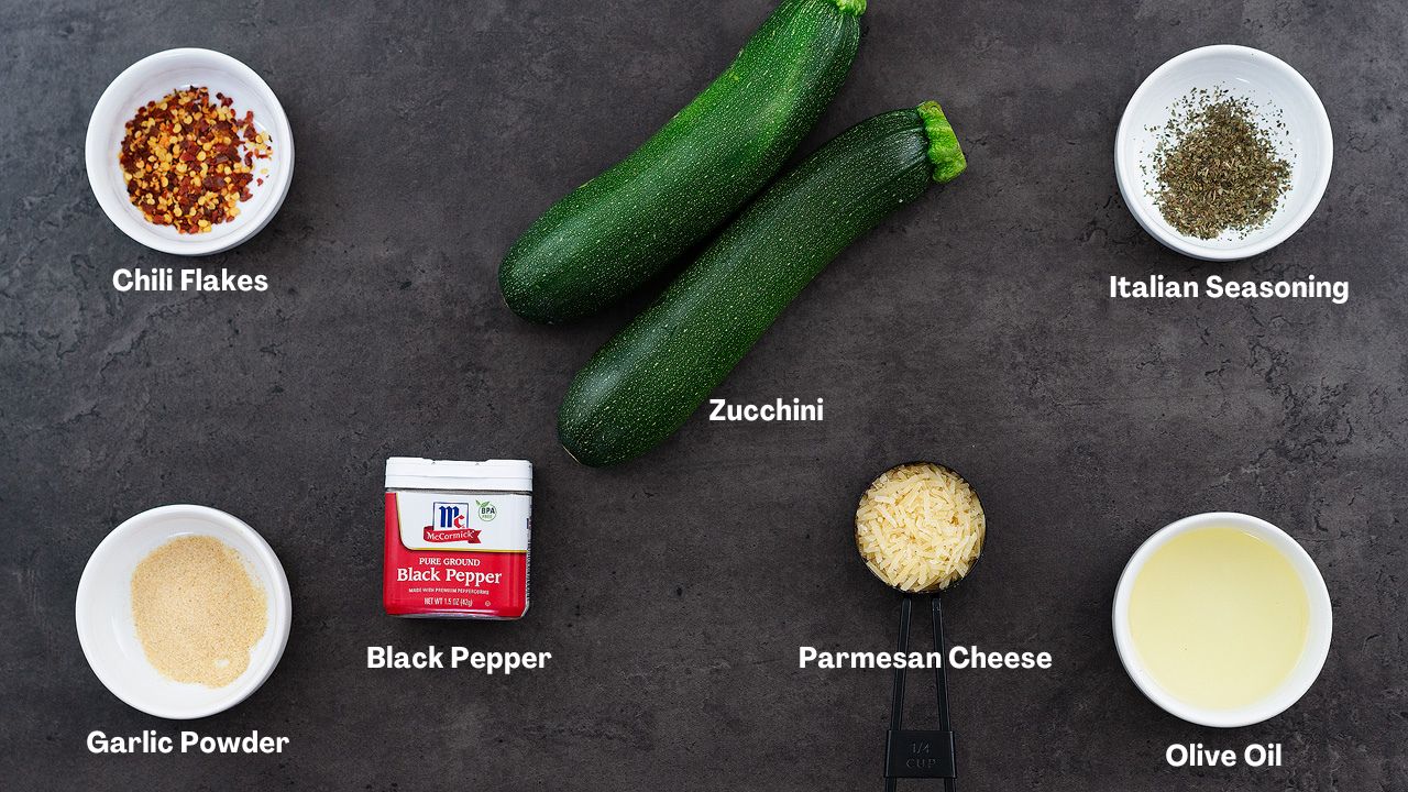 Roasted Zucchini ingredients arranged on a grey table.