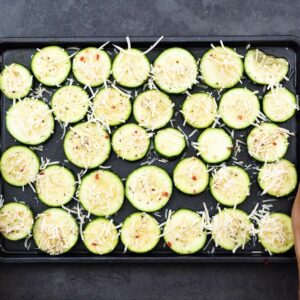 Seasoned Zucchini placed in a baking tray.