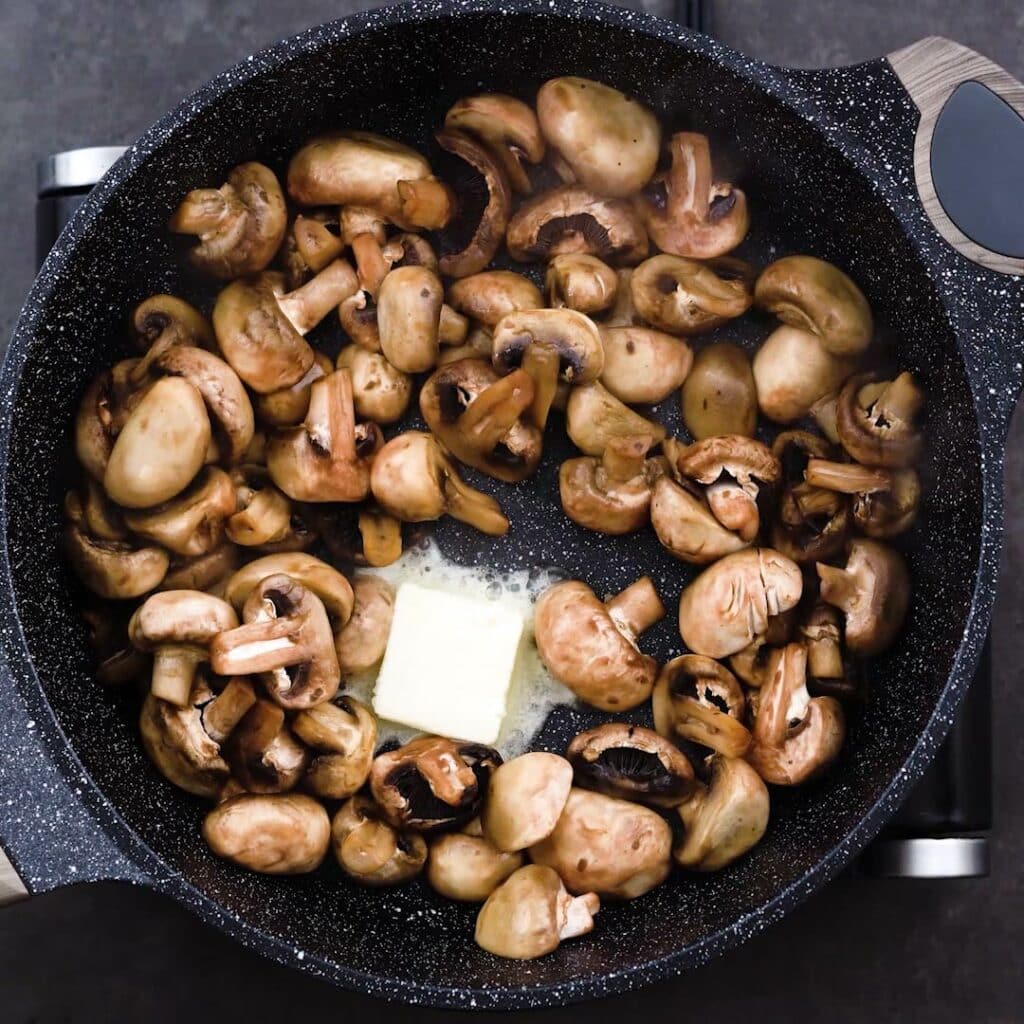 A pan with mushroom and butter.