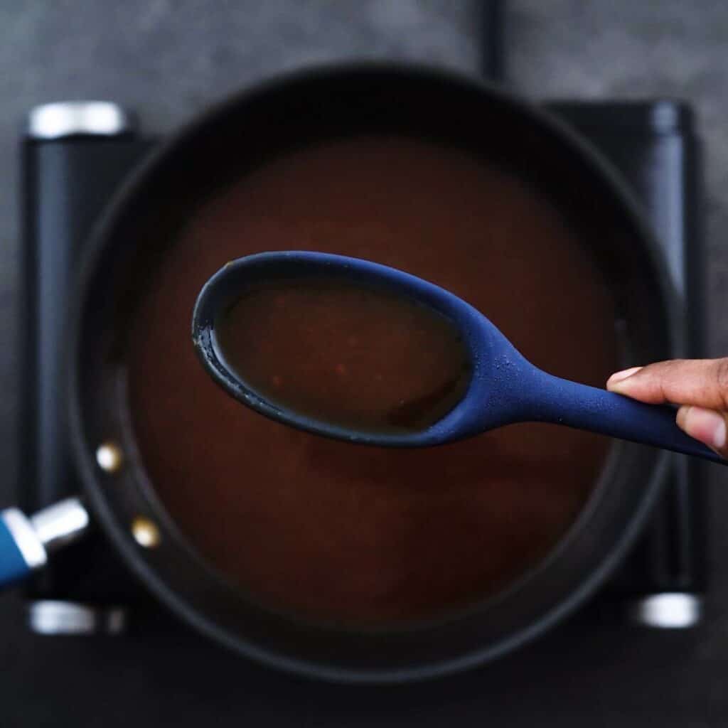 Showing the consistency of sweet and sour sauce.