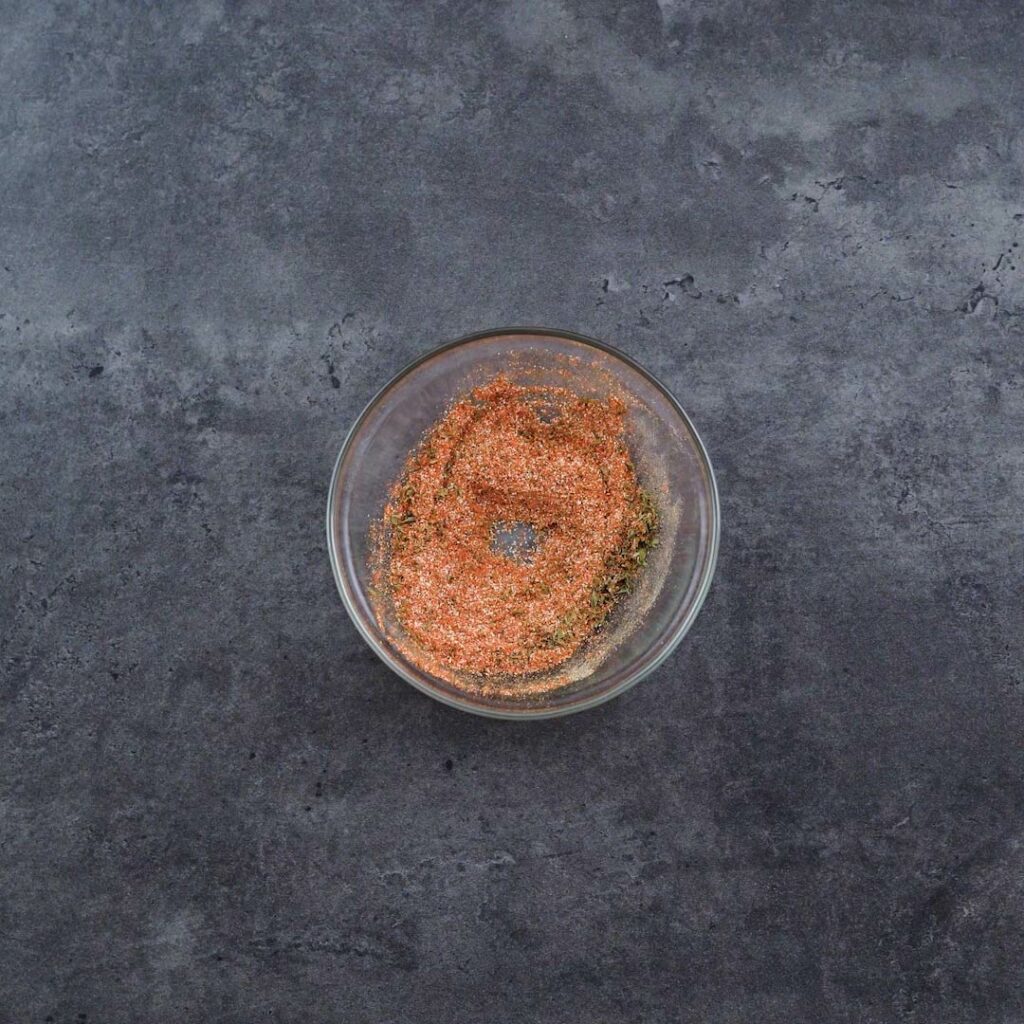 A bowl with seasoning mix.