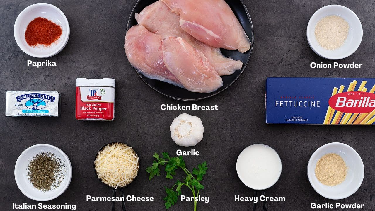 Chicken Fettuccine Alfredo Pasta recipe ingredients arranged on a grey table.