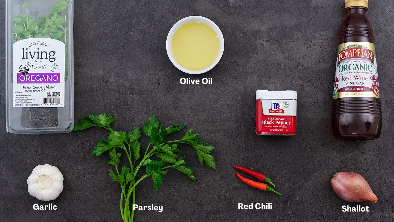 Chimichurri Sauce recipe ingredients arranged on a grey table.