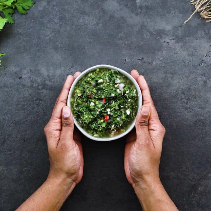 Serving the Chimichurri Sauce in a white bowl.