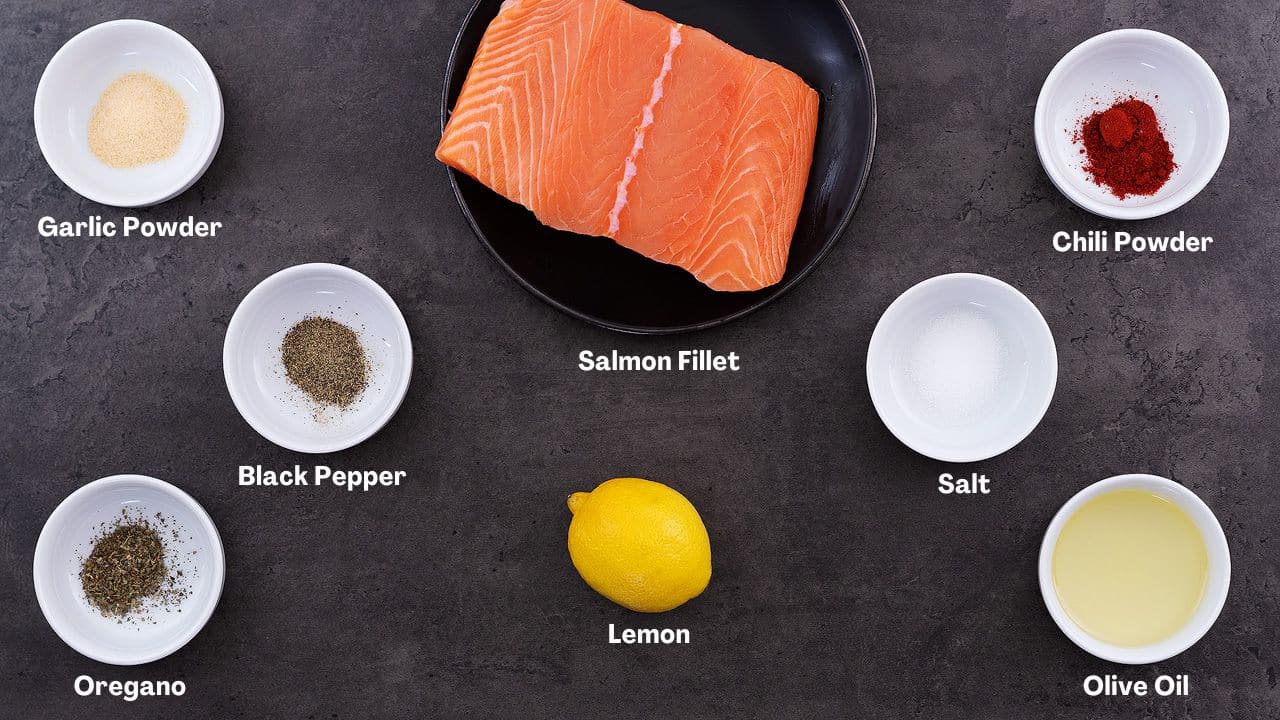 Baked Salmon recipe Ingredients arranged on a grey table.