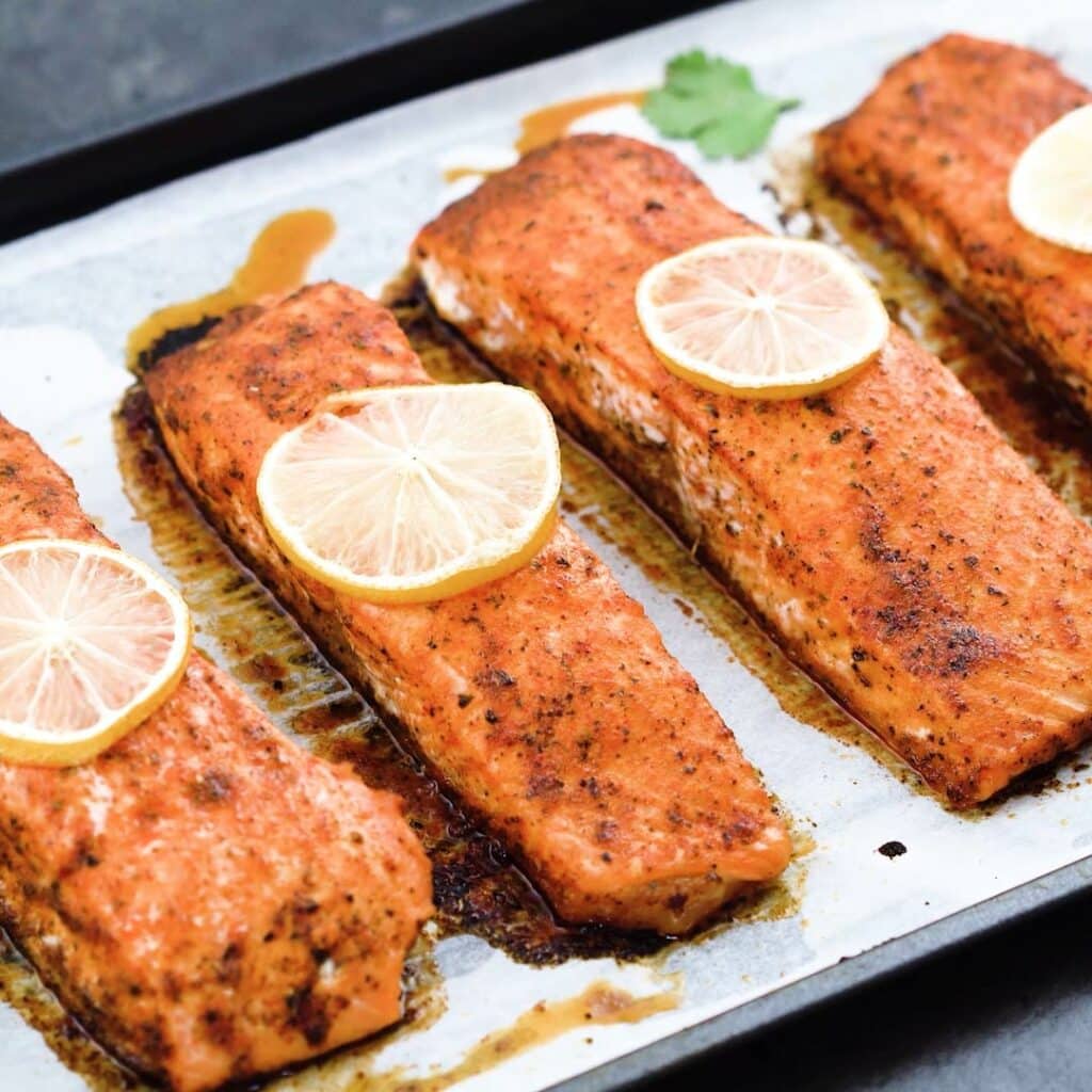 Baked salmon served in a tray.