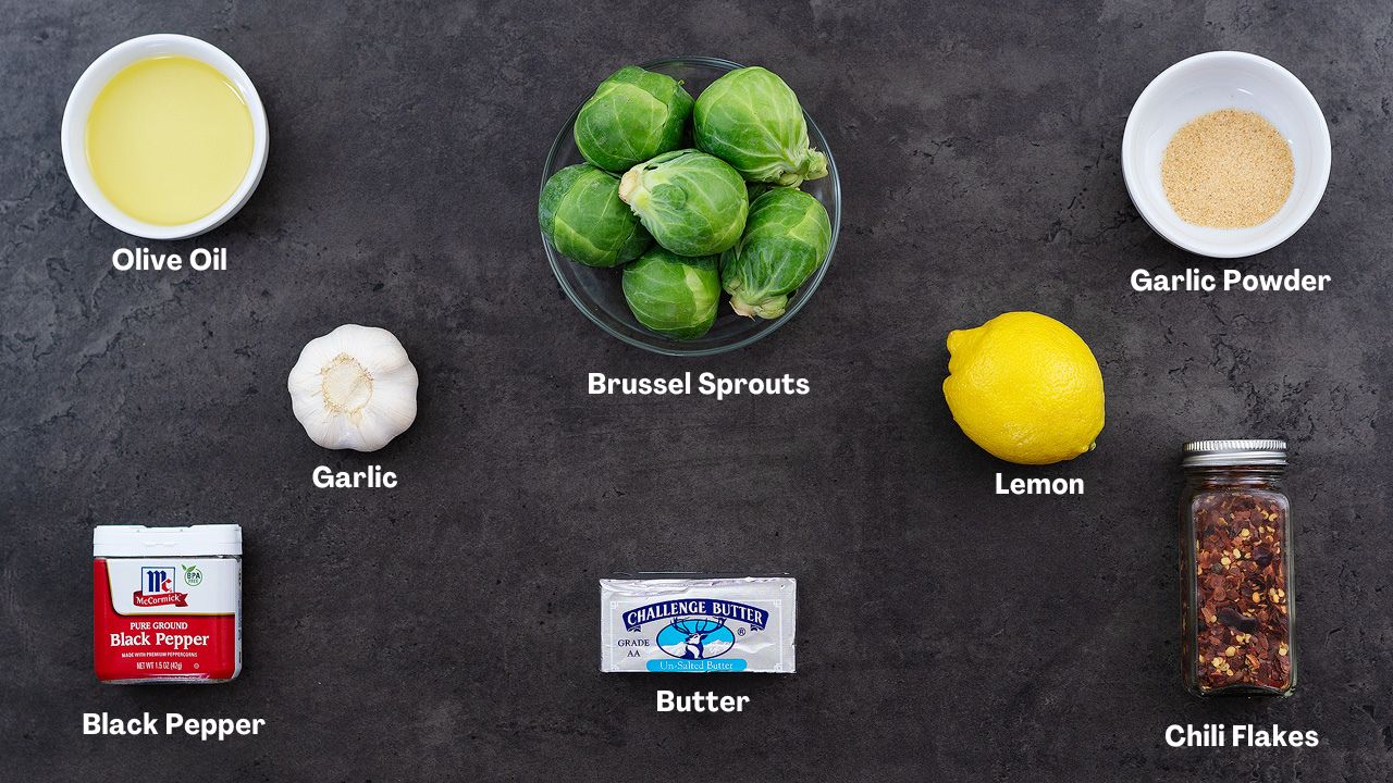 Sauteed Brussel Sprouts recipe Ingredients arranged on a grey table.