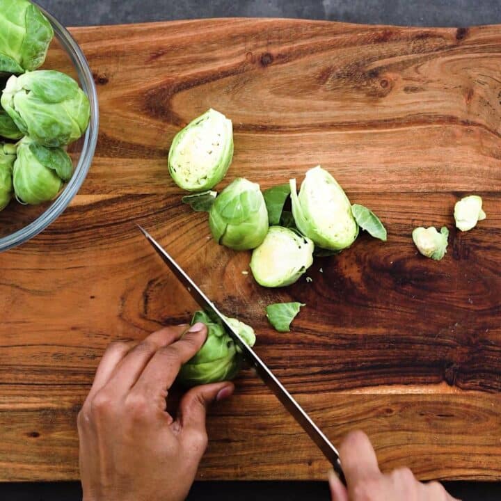 Trimming and cutting the Brussels Sprouts.