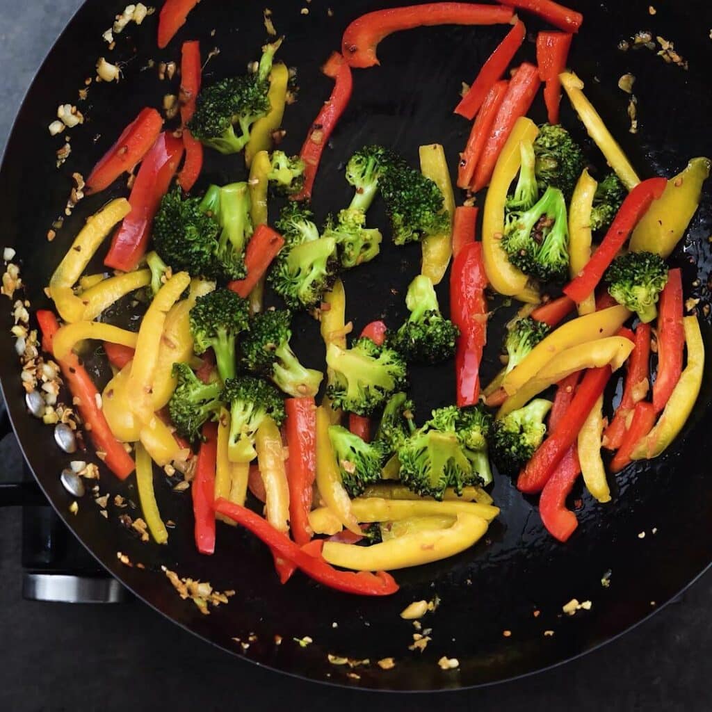A wok with stir fried veggies.