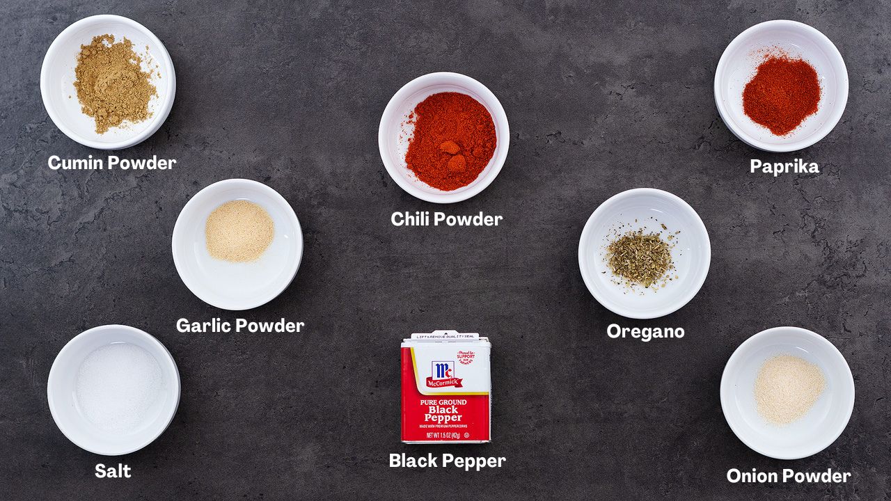 Taco Seasoning recipe Ingredients arranged on a grey table.