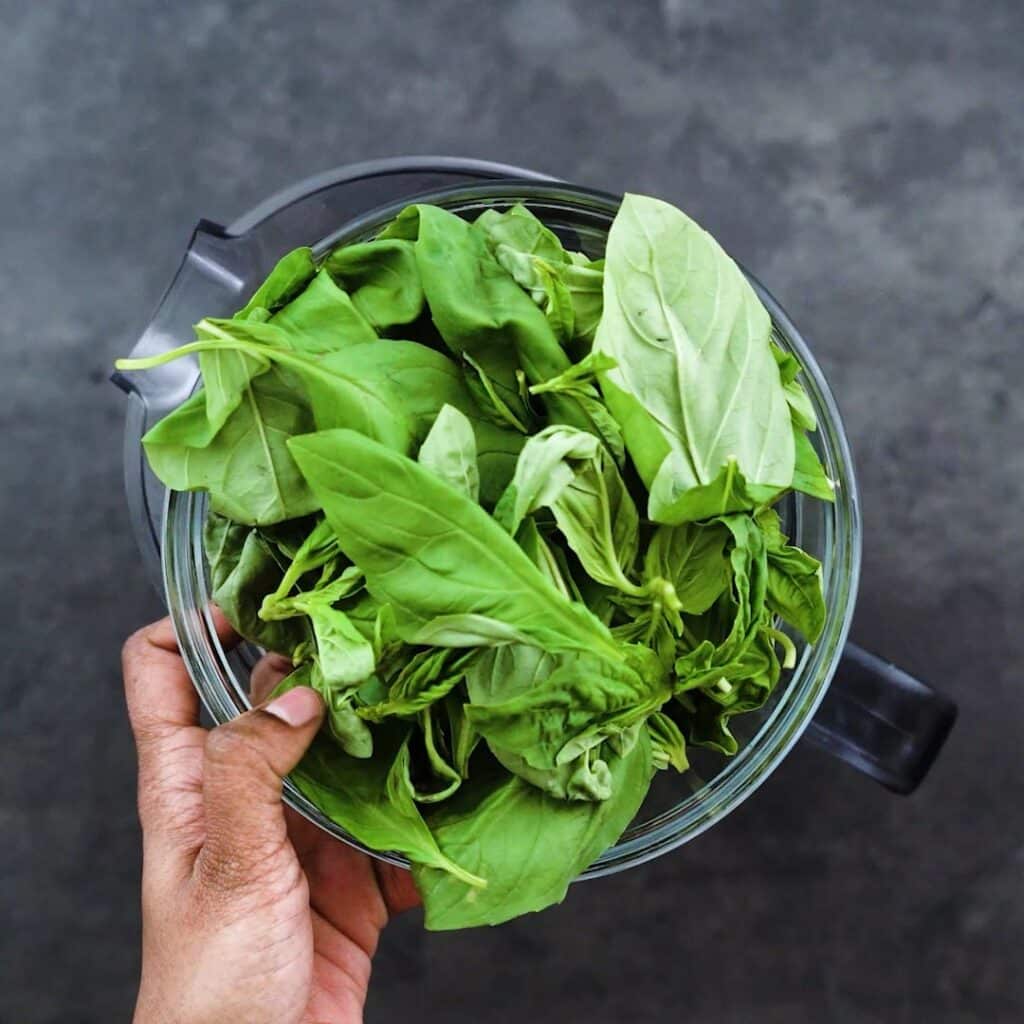 A bowl with basil leaves.