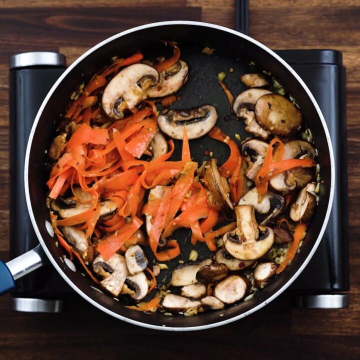 A pan with softened veggies.