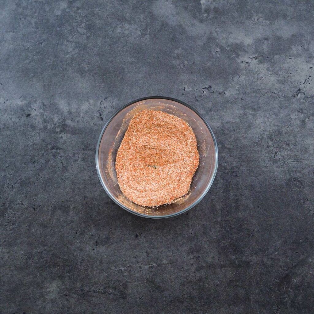 A bowl with seasoning spice powders.