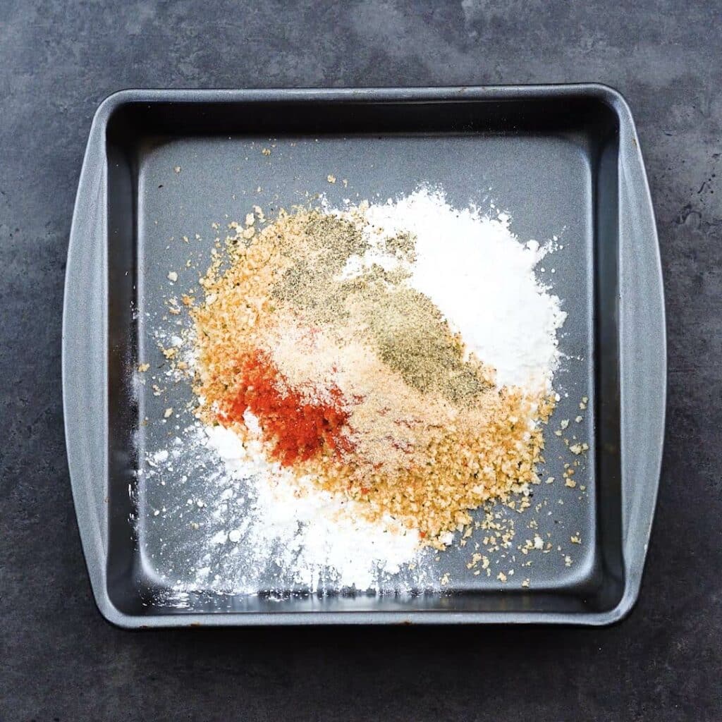 A shallow tray with breading mixture.