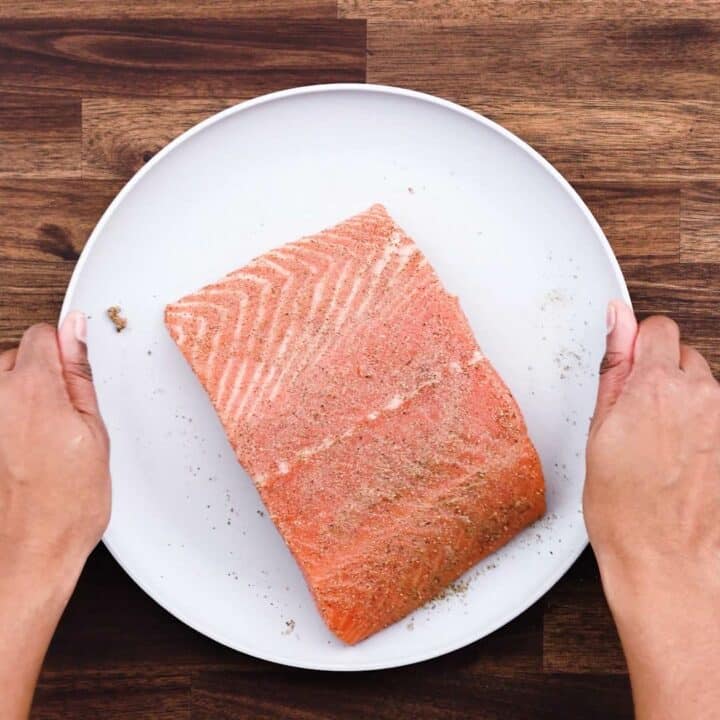 A plate with seasoned salmon fillets.