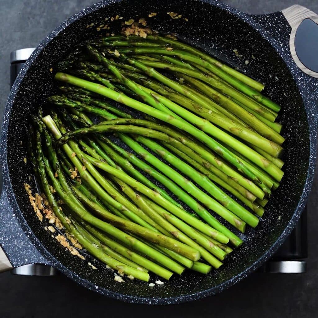 A pan with Sauteed Asparagus.