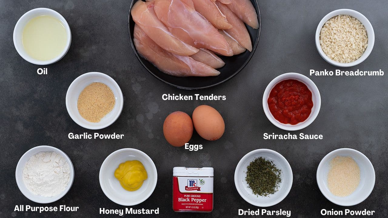 Oven Fried Chicken Tenders recipe Ingredients arranged on a grey table.