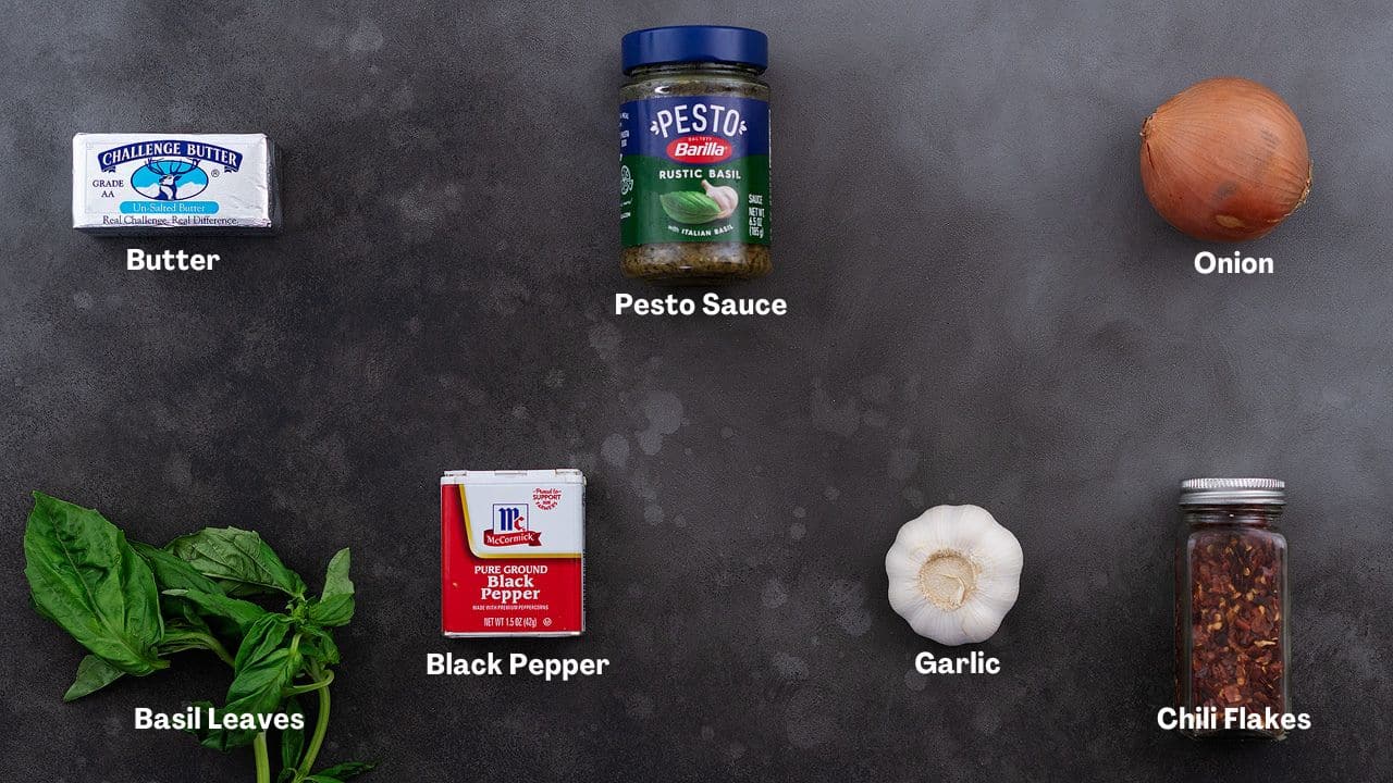 Pesto Chicken recipe Ingredients arranged on a grey table.
