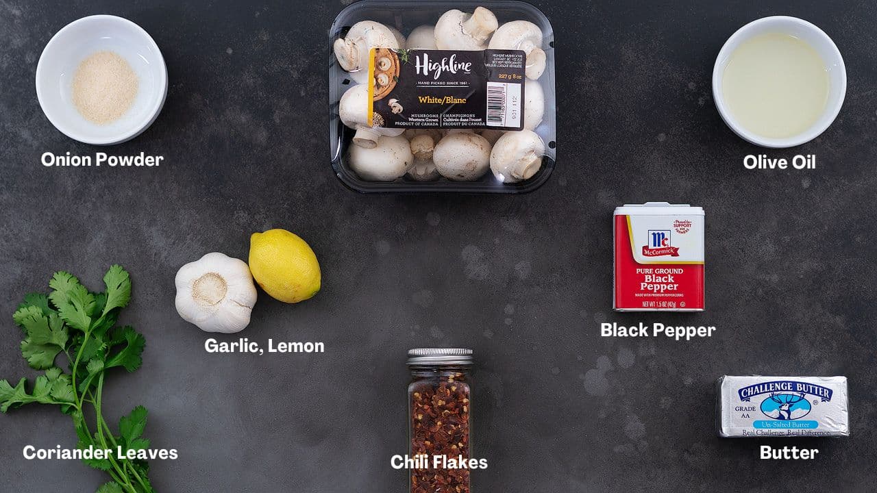 Garlic Mushrooms recipe Ingredients arranged on a grey table.