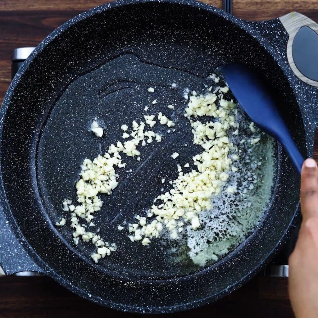 Sauteing garlic in olive oil and butter.