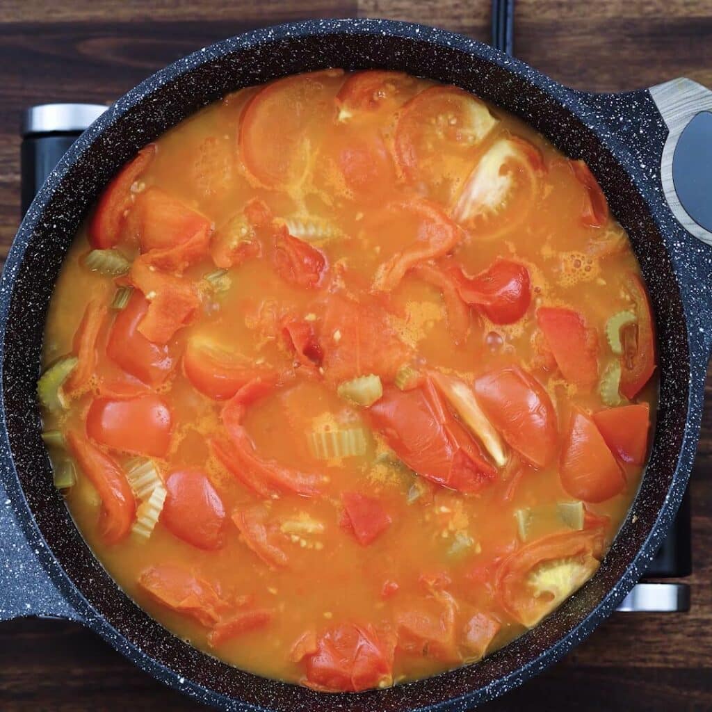 A pan with mushy tomato mixture.