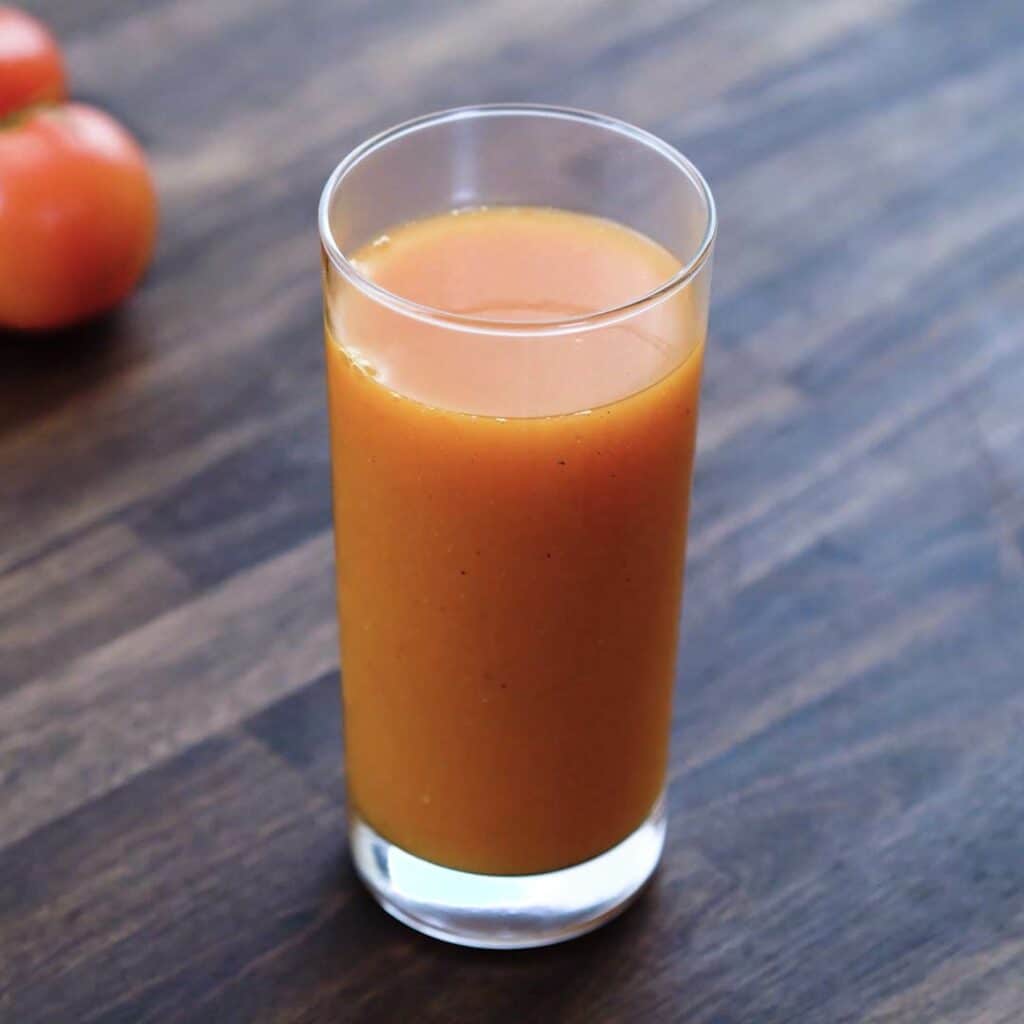 Tomato Juice served in a tall serving glass.